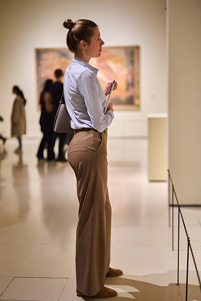 istock visitor in historical museum looking at art object 2205761571