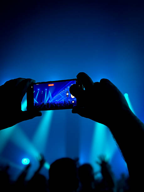 istock Concertgoer Recording a Live Music Event with an iPhone 2205763875