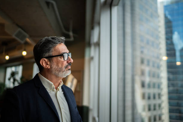 istock Visionary Leadership - Confident Businessman Reflecting on Future Opportunities 2205764951