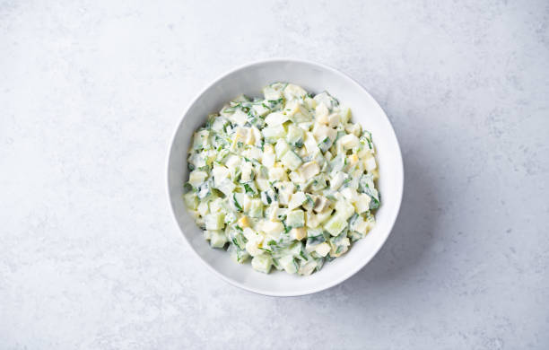 istock Egg cucumber avocado salad with mayonnaise sauce in a bowl 2205765037