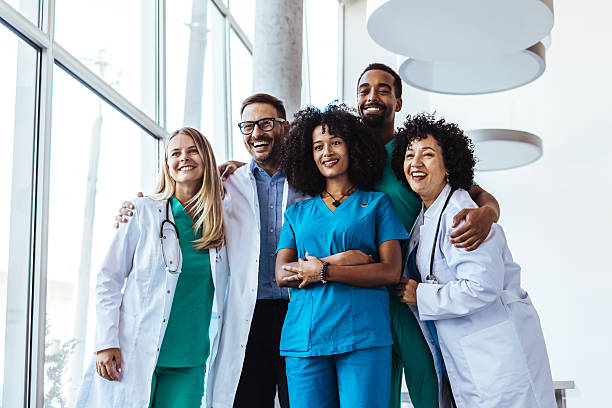 istock Medical Team Smiling Together in a Modern Professional Environment 2205765936