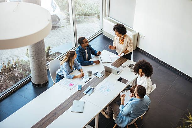 istock Diverse Team Collaborating in a Modern Office on a Bright Day 2205767865