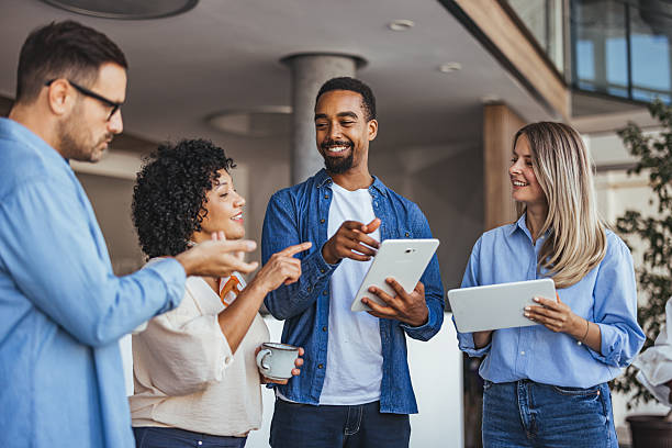 istock Group of Professionals Collaborating in a Modern Office Setting 2205767927