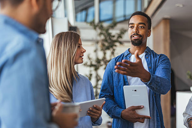 istock Diverse Business Team Discussing Project Collaboration in Modern Office Environment 2205768070