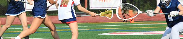 istock Girls Lacrosse Player taking a shot on goal 2205769762