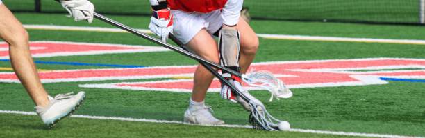 istock Lacrosse Players Compete for Possession on a Match on a Turf Field 2205769781