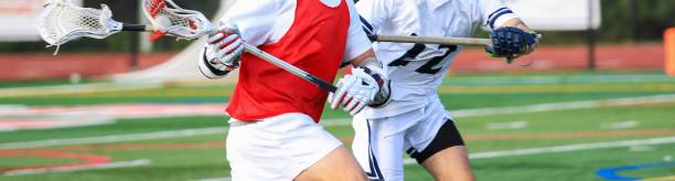istock Lacrosse Players Engaged in Intense Lacrosse Match 2205769793