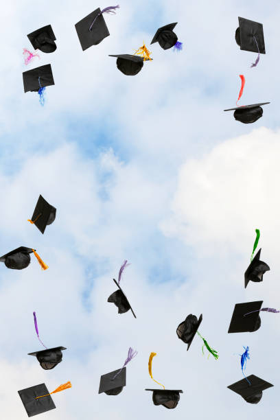 istock Graduation caps thrown in the sky 2205769999