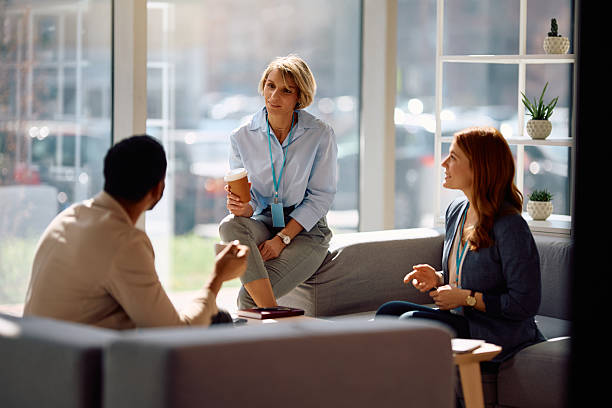 istock Group of business coworkers communicating on a coffee break at work. 2205770839