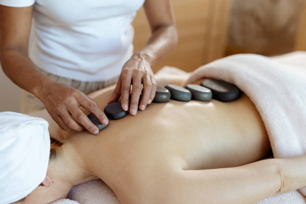 istock Woman enjoying a hot stone massage 2205771189