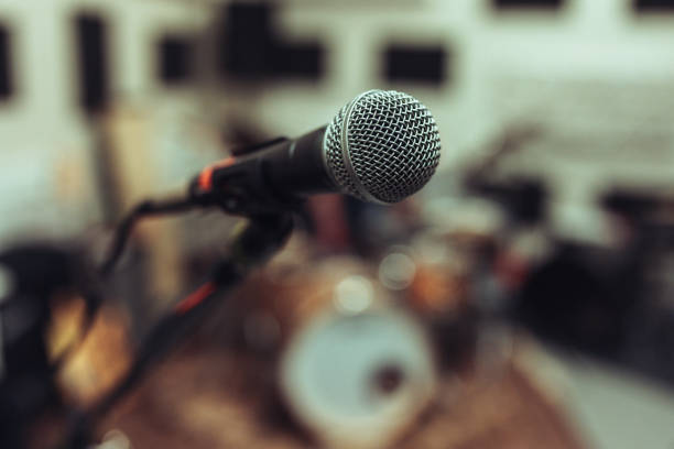 istock Close-up of a microphone in a rehearsal studio 2205772351