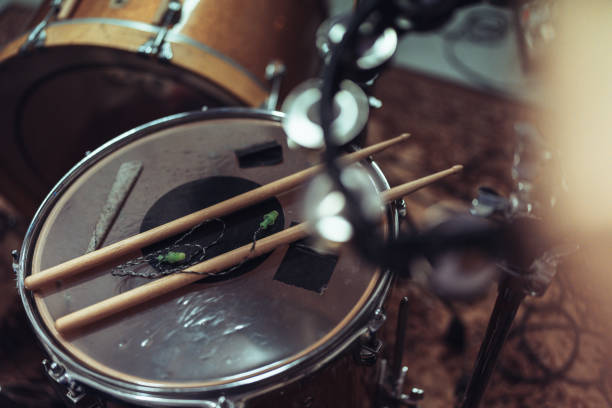 istock Close-up of a drum set with drumsticks 2205772366