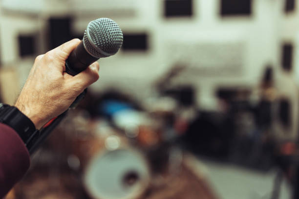 istock Close-up of a microphone in a rehearsal studio 2205772388