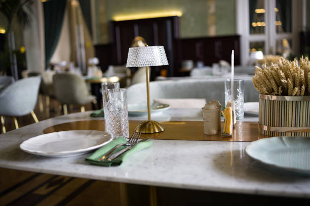 istock modern table setting in a trendy restaurant. Sofa, armchair, table and dishes on the table 2205773046