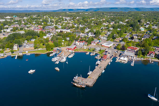 istock Baddeck marina aerial view, with the town pier extending into calm harbour waters. 2205774889