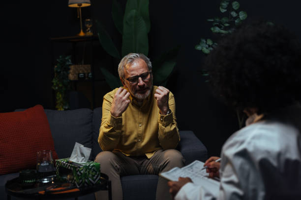 istock Mature man talking to his therapist during a session 2205776833