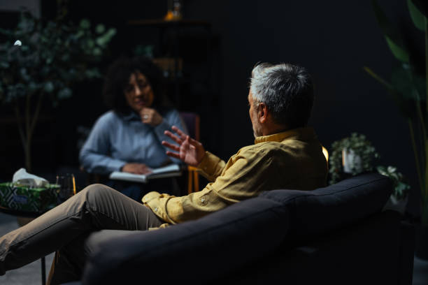istock Mature man talking to his therapist during a session 2205776866