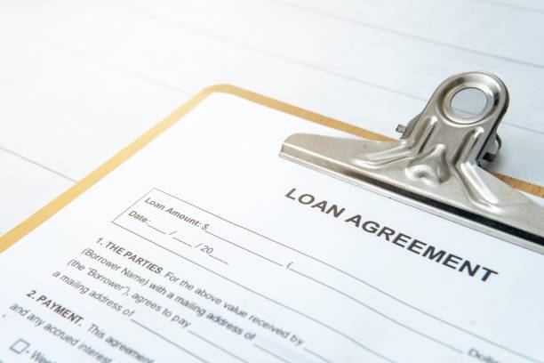 istock A LOAN AGREEMENT document on a clipboard with a metal clip. 2205777066