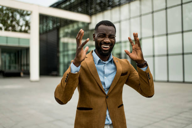 istock Furious black businessman screaming at financial district. 2205777116
