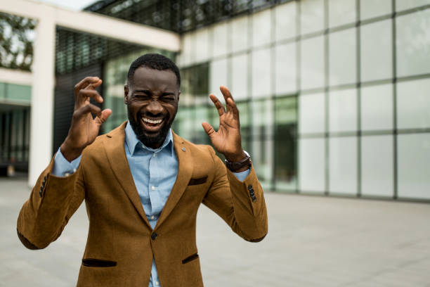 istock Furious black businessman screaming at financial district. 2205777156