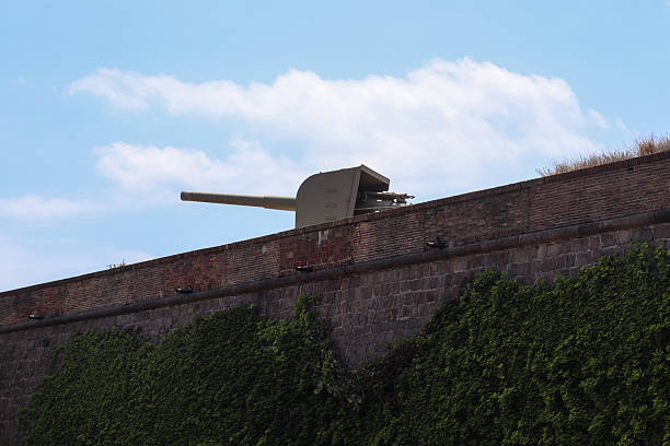 Barcelona, Spain 21. July 2024, Large Vickers naval gun pointing towards the sky from the top of Montjuic Castle, military museum in Barcelona