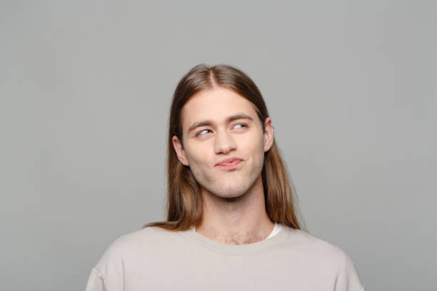 istock Headshot of surprised young man 2205778058