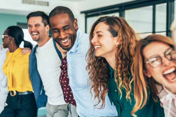 istock Cheerful team huddle in the office 2205778240