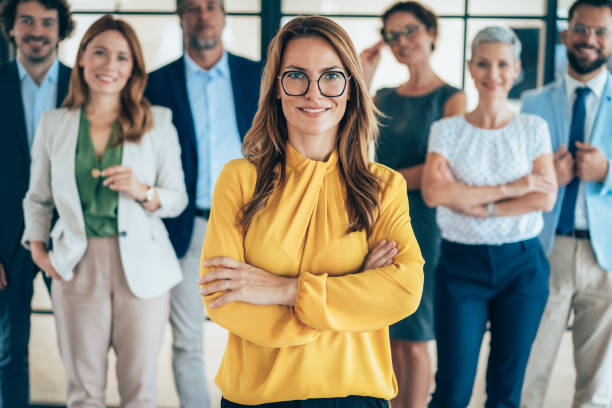 istock Confident business woman and her team 2205778244