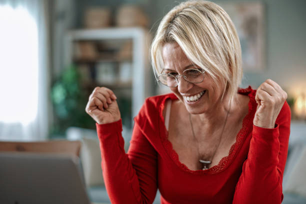 istock Senior woman using a laptop computer at home 2205779243