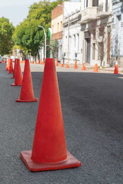 istock Orange traffic cones creating a barrier for vehicles.Vertical frame. 2205779391