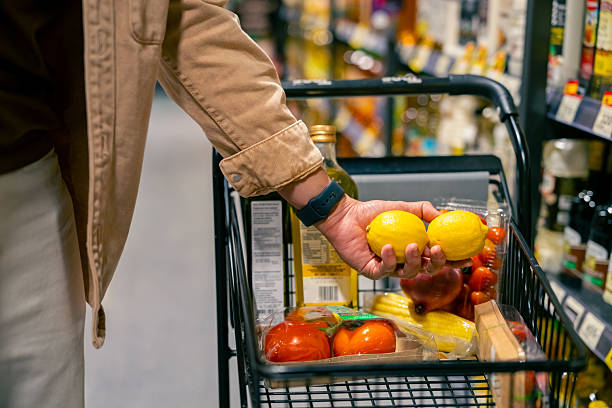 istock Asian man shopping at supermarket. 2205779944