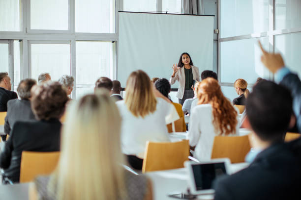 istock Diverse Professionals Engaging in Lively Business Conference Discussion 2205781678
