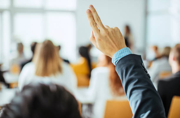 istock Caucasian Businessman Inquisitive at Conference Event 2205781687