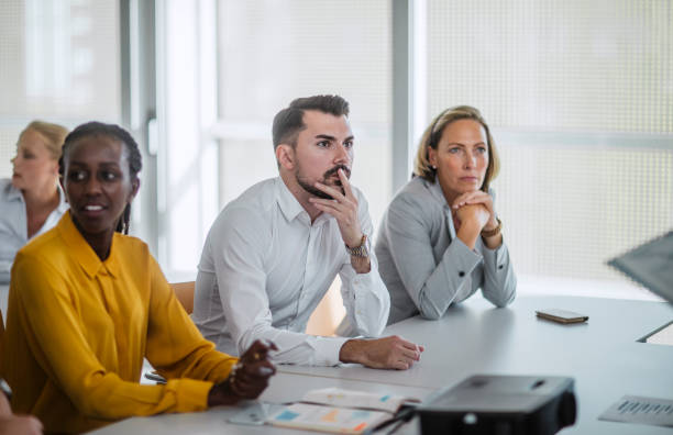 istock Engaged Diverse Professionals Collaborate at Business Conference 2205781694