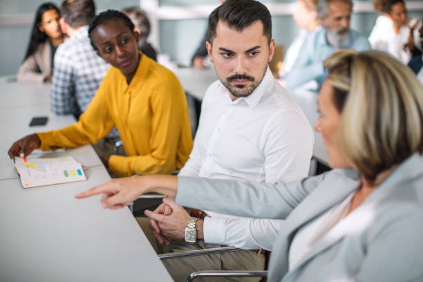 istock Engaged Diverse Professionals Discussing Strategies 2205781704