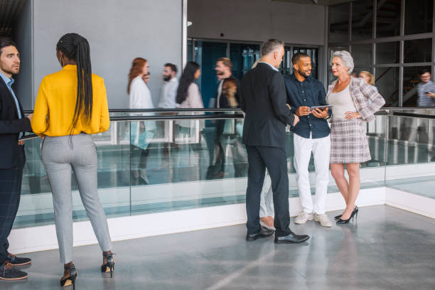 istock Diverse Professionals Engaging at Lively Business Conference 2205781707
