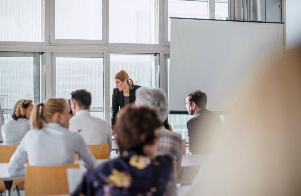 istock Engaged Diverse Professionals Discussing Ideas at Conference Event 2205781708