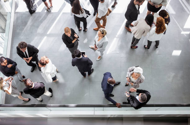 istock Diverse Professionals Engaging at Business Conference 2205781730