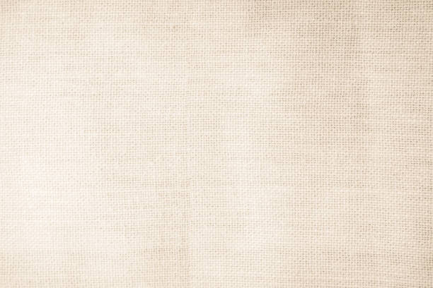 istock Brown sackcloth woven texture background in natural pattern. Jute hessian burlap, linen background in light beige cream color blank. Weaving canvas fiber line cotton cloth textured as organic. 2205781931