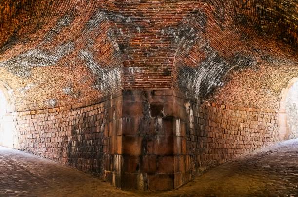 istock Vaulted brick ceiling merging into stone walls in Barcelona 2205783240