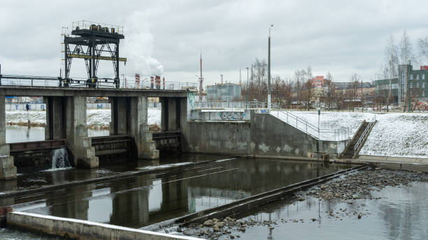 istock A winter scene of a river dam, showcasing the engineering marvel controlling water release. The icy landscape highlights the dam's role in managing water flow and preventing flooding. 2205787823