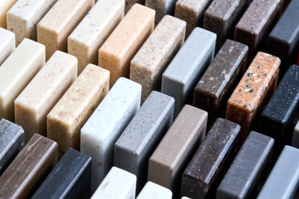 istock Porcelain stoneware artificial stone square samples as kitchen countertop examples of future kitchen fasade exterior. Samples slabs of natural granite marble quartz for stone countertops close up. 2205789715