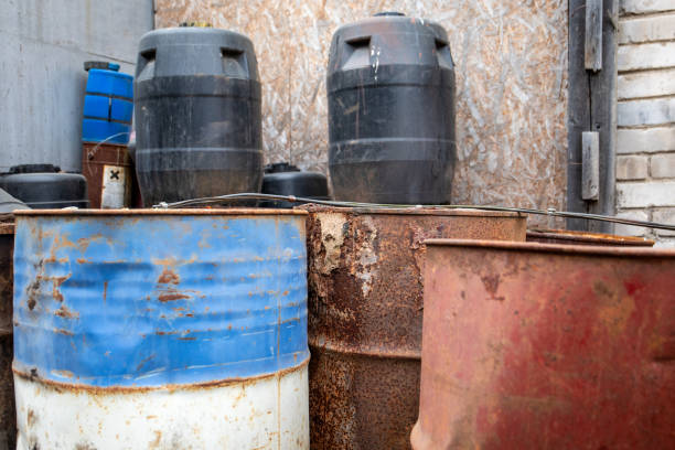 istock Rusty and Weathered Barrels in Industrial Storage Area 2205790488