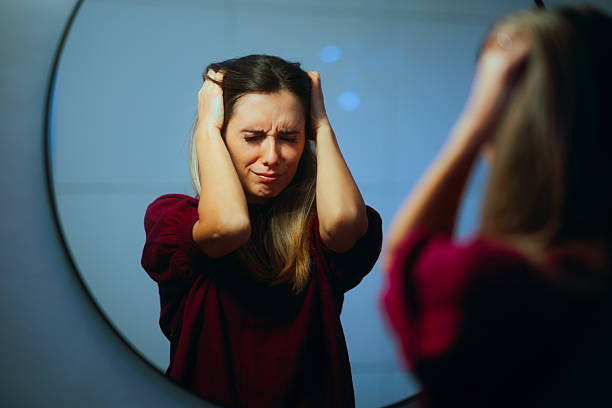 Sad Woman Crying Looking in the Mirror Feeling Desperate