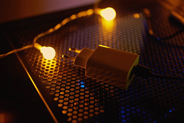 istock Phone charger at night on a tech table with neon lights. 2205796063