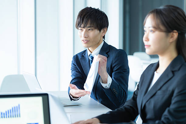 istock young businessmen having a meeting 2205796921