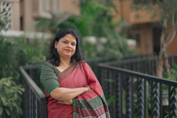 istock Confident Middle-Aged Indian Woman in Saree Smiling 2205798268