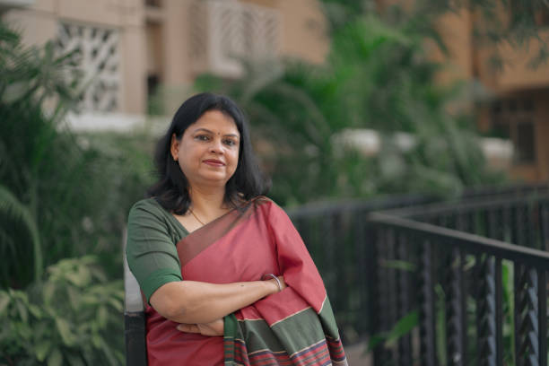 istock Confident Middle-Aged Indian Woman in Saree Smiling 2205798276