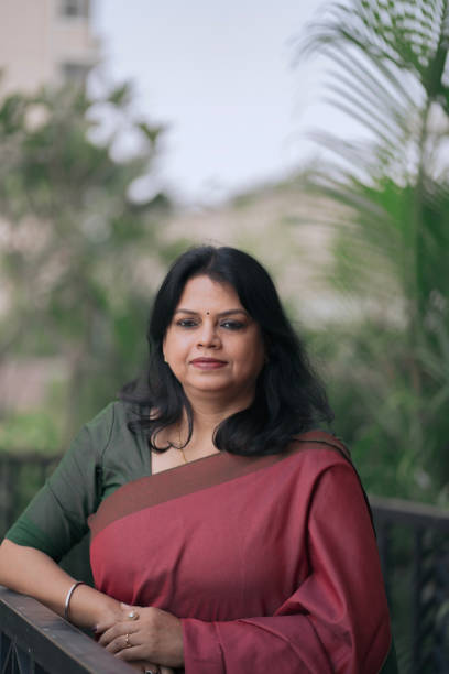 istock Confident Middle-Aged Indian Woman in Saree Smiling 2205798311