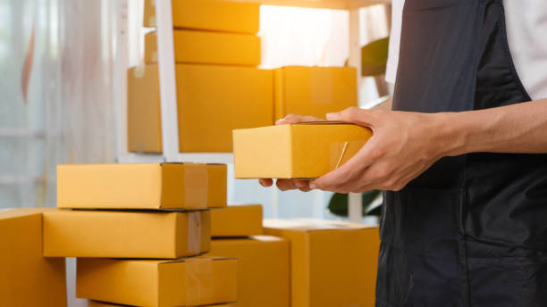 istock SME and packaging delivery concept. Small entrepreneurs are preparing packages to send to customers. Starting Small business entrepreneur SME freelance. Online business, Work at home concept. 2205800533